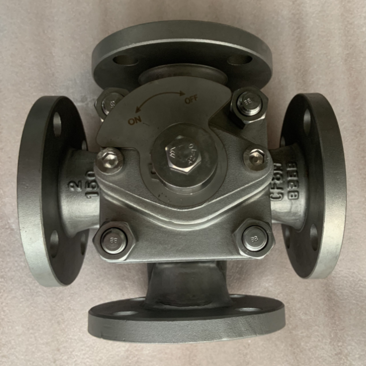 Four way sleeved plug valve